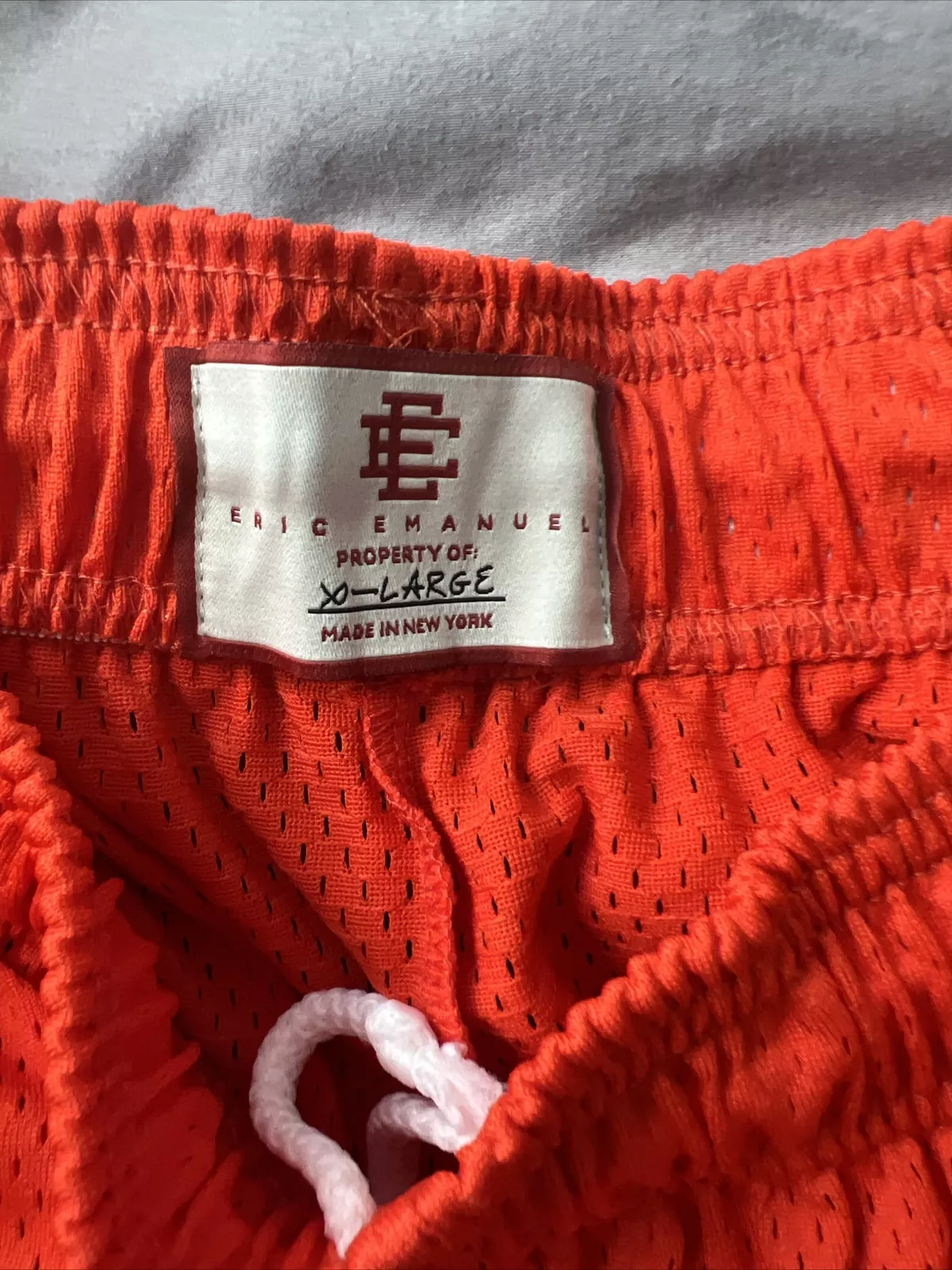 Eric Emanuel Men’s Shorts – Orange Mesh Basketball Shorts with Iconic EE Branding